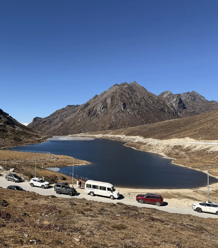 Sela Lake beside the pass road, snow peaks rising behind