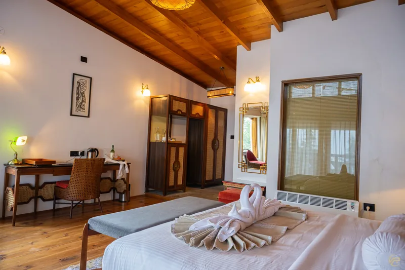 The wardrobe and turndown, seen from the foot of the bed — Timilo Classic, Timilo Boutique
