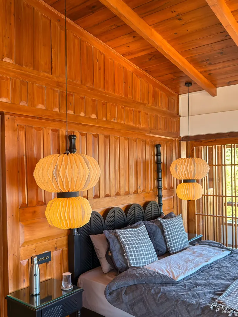 The bed, lanterns and hand-blocked cushions — Presidential Suite, Timilo Boutique