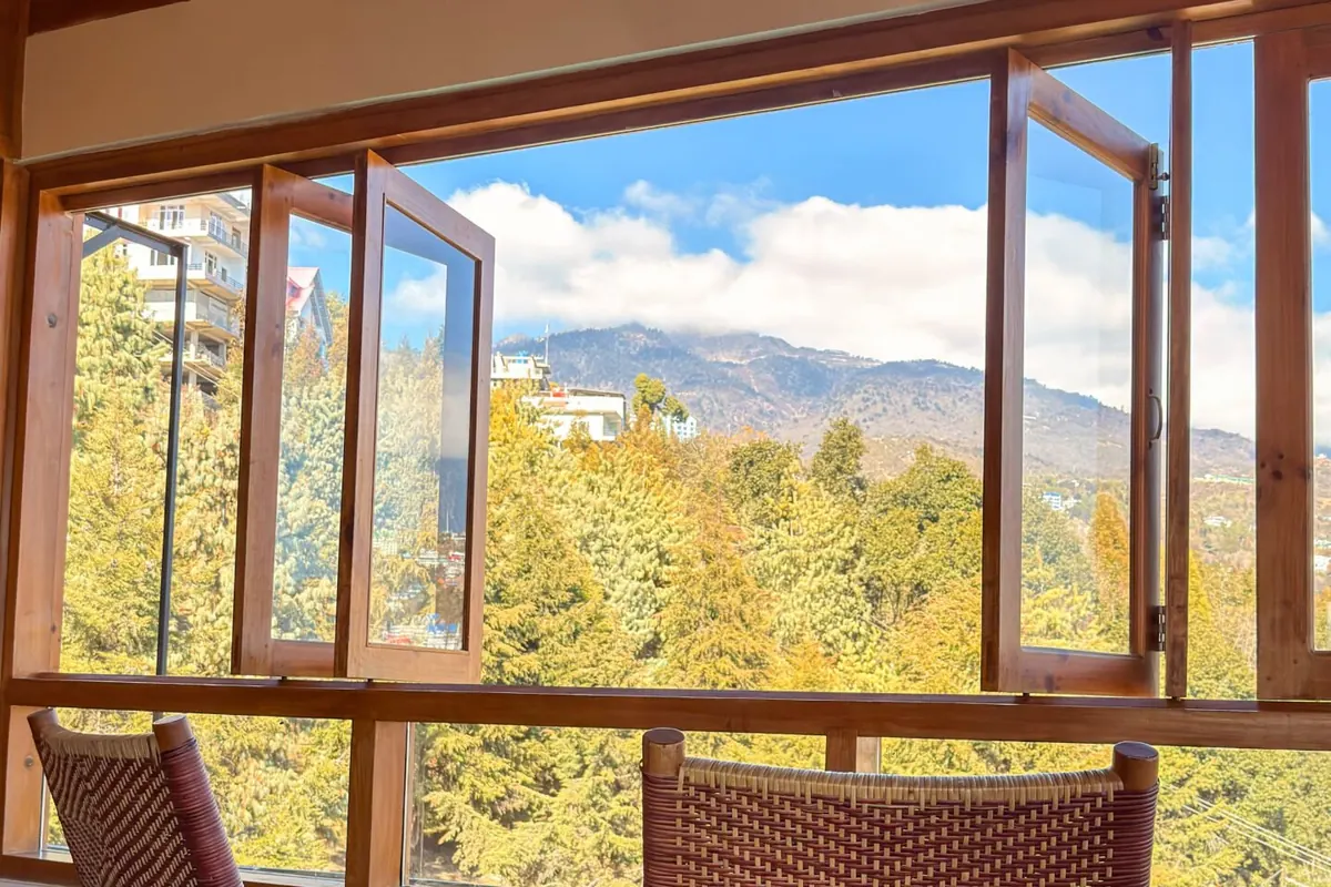 The sun room of the Presidential Suite, chairs turned to the mountains
