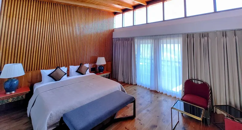 Clerestory windows running above the beds, under a pine ceiling — Timilo Royal Double, Timilo Boutique
