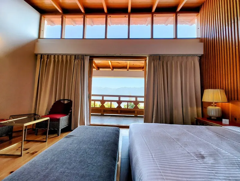 The valley, framed by the open balcony doors — Timilo Royal Double, Timilo Boutique